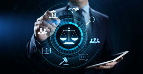 Man in a suit engaging with screen on which there are legal items represented